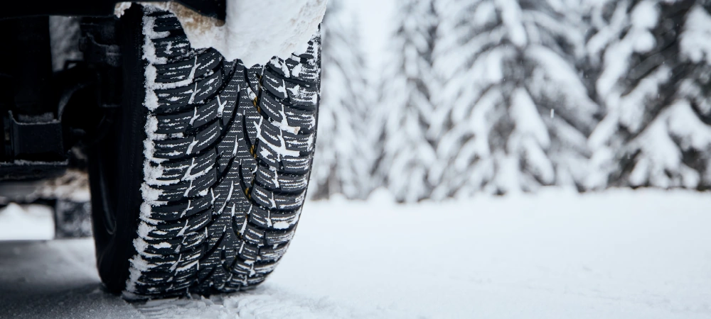 A tyre covered in snow.