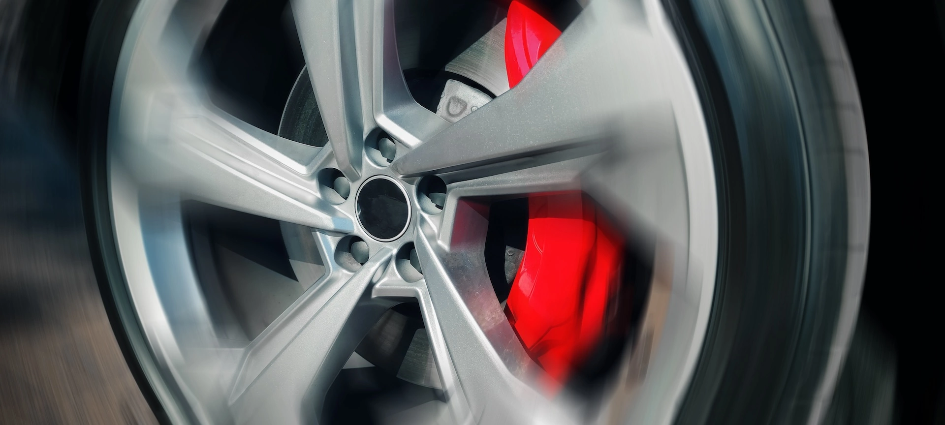 Red brake caliper on a wheel